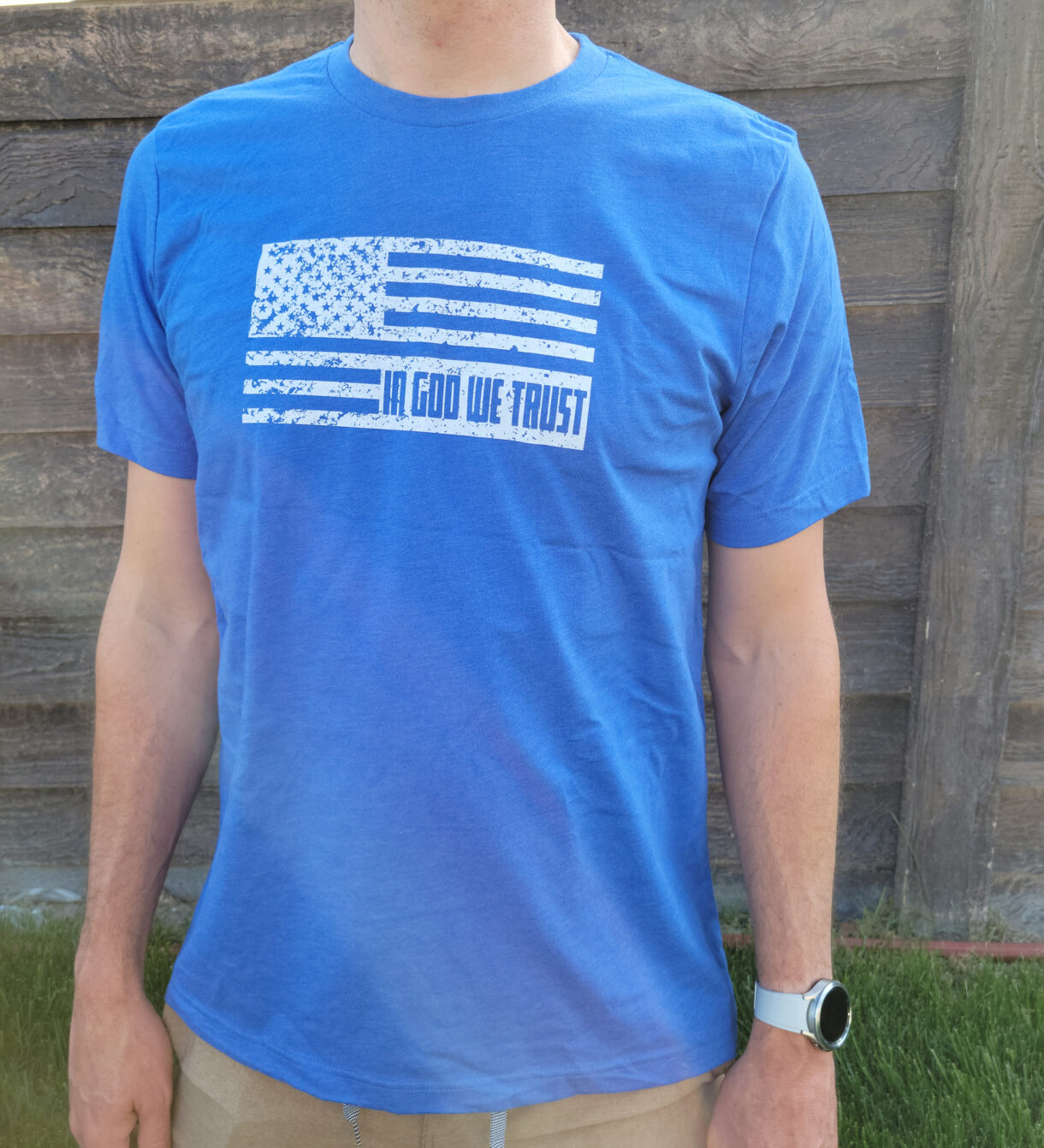 Blue tee with white flag and in god we trust