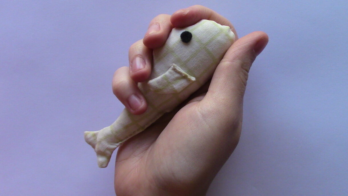 handsewn pocket sized cream and white patterned stuffed fish