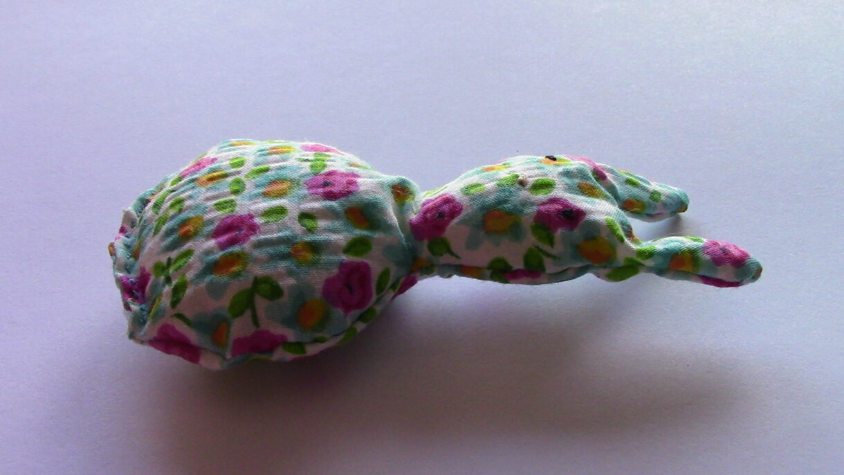 handsewn pocket sized flower patterned stuffed rabbit
