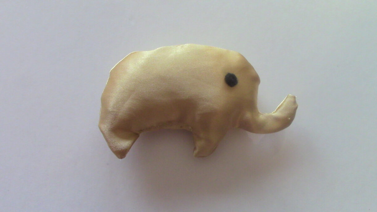 hand sewn pocket sized gold stuffed elephant