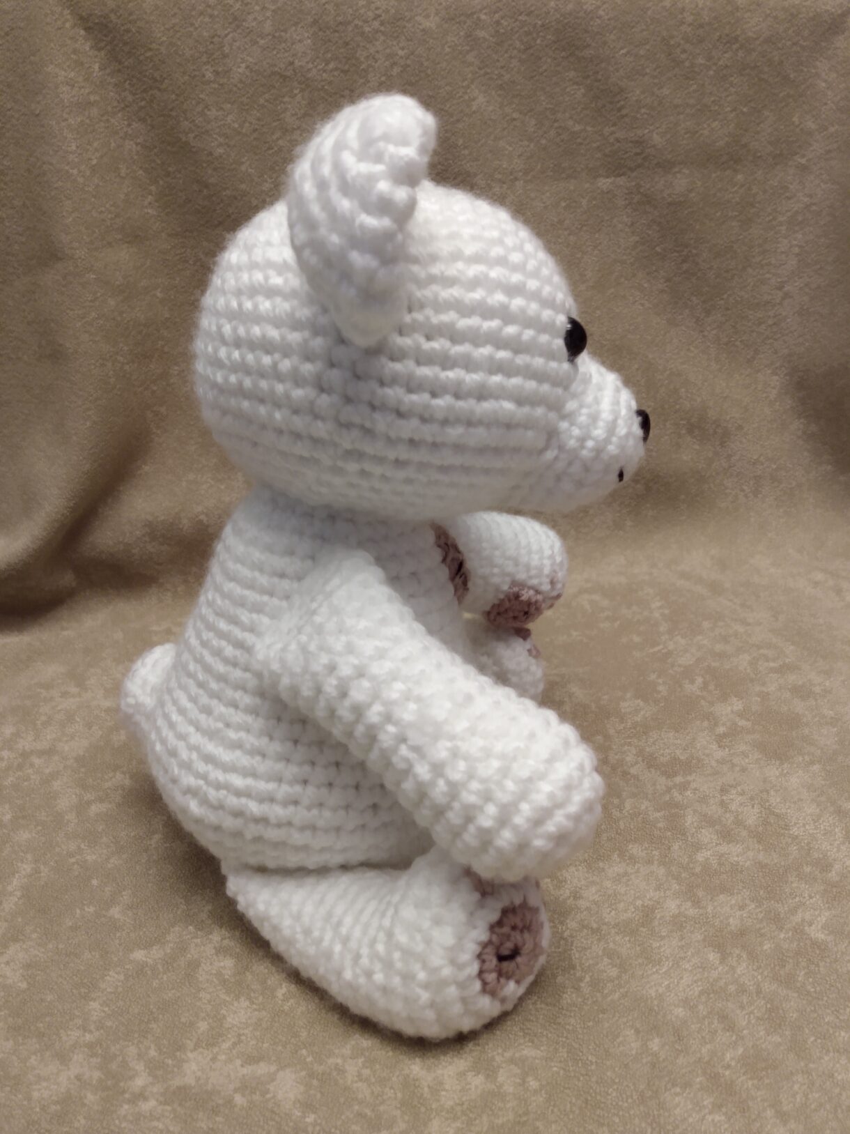 White and pink bear side view