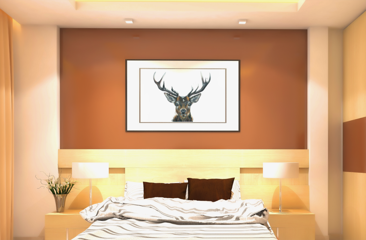 red deer frame hanging over bed