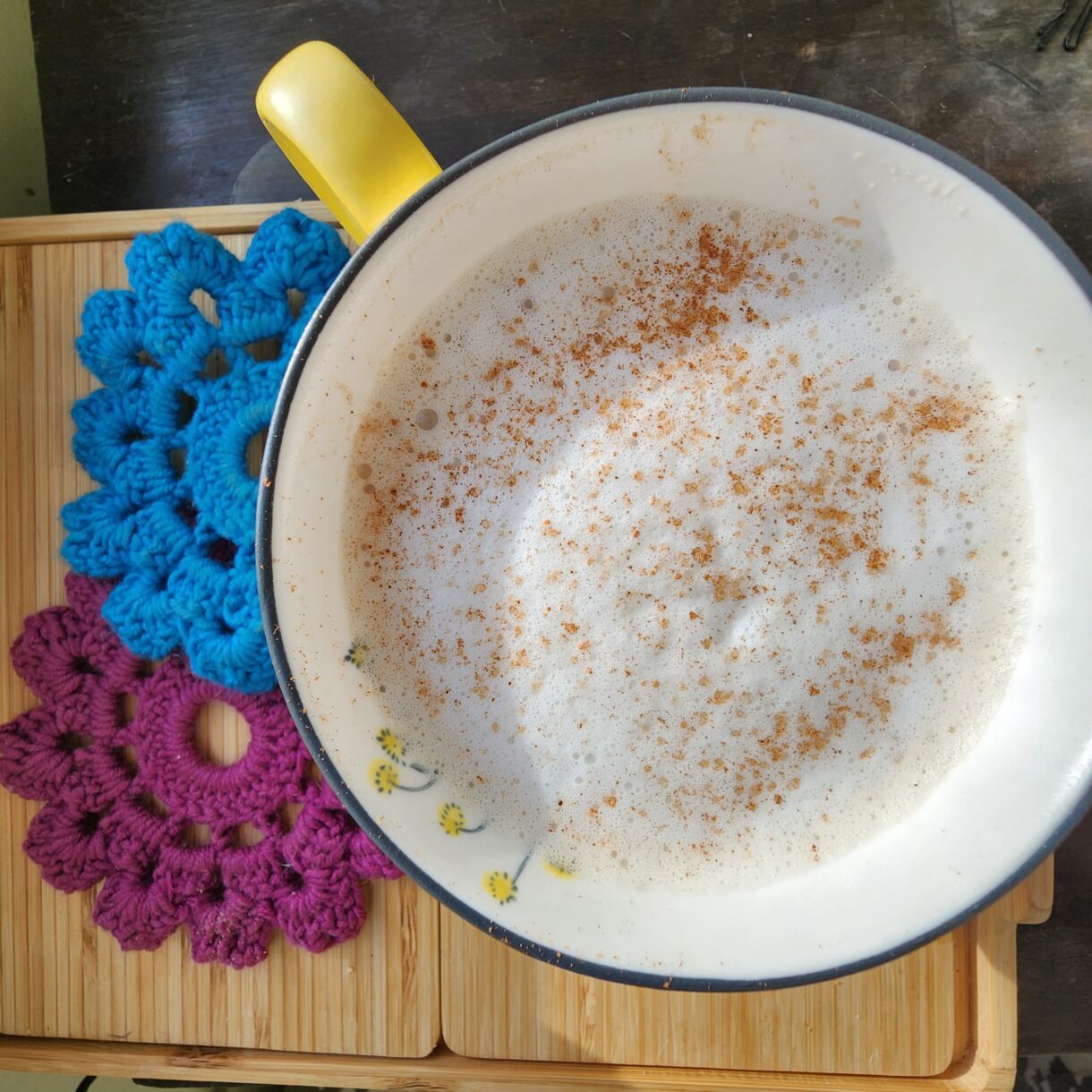 Chai latte with foam sprinkled with cinnamon