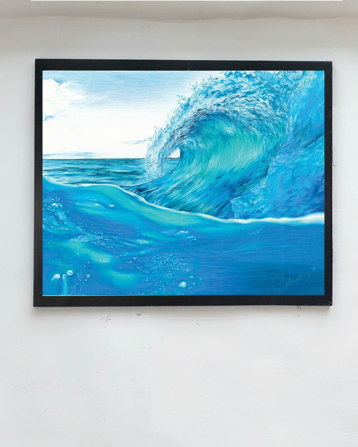 wave art print hanging on wall