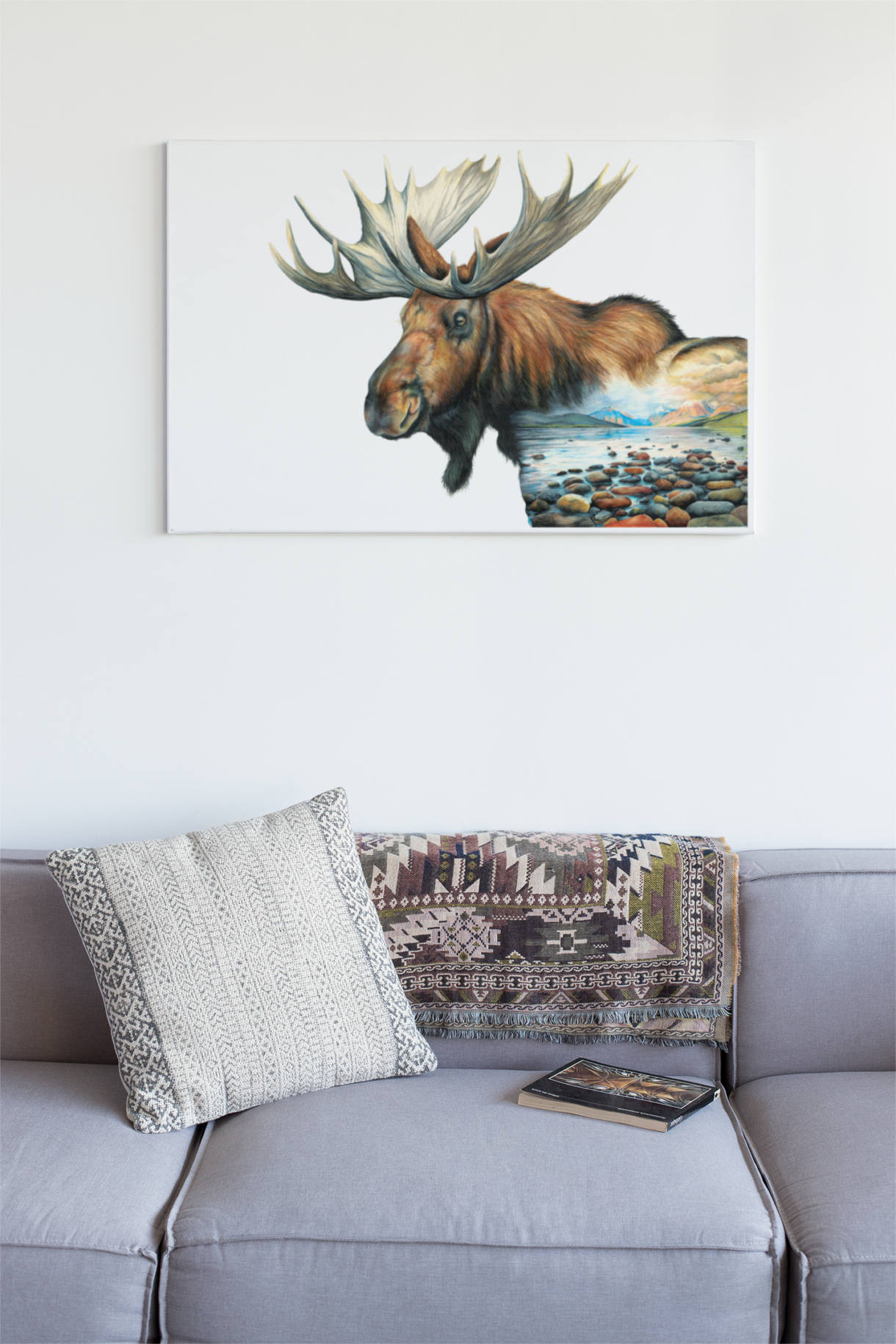 moose art hanging on wall over couch
