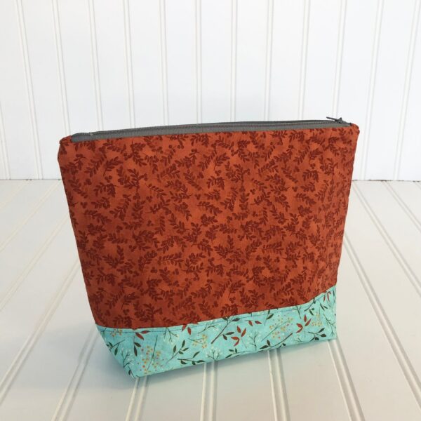 Rust and floral zippered pouch