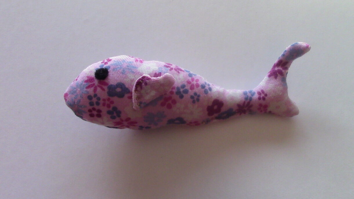 hand sewn pocket sized pink flower patterned stuffed fish