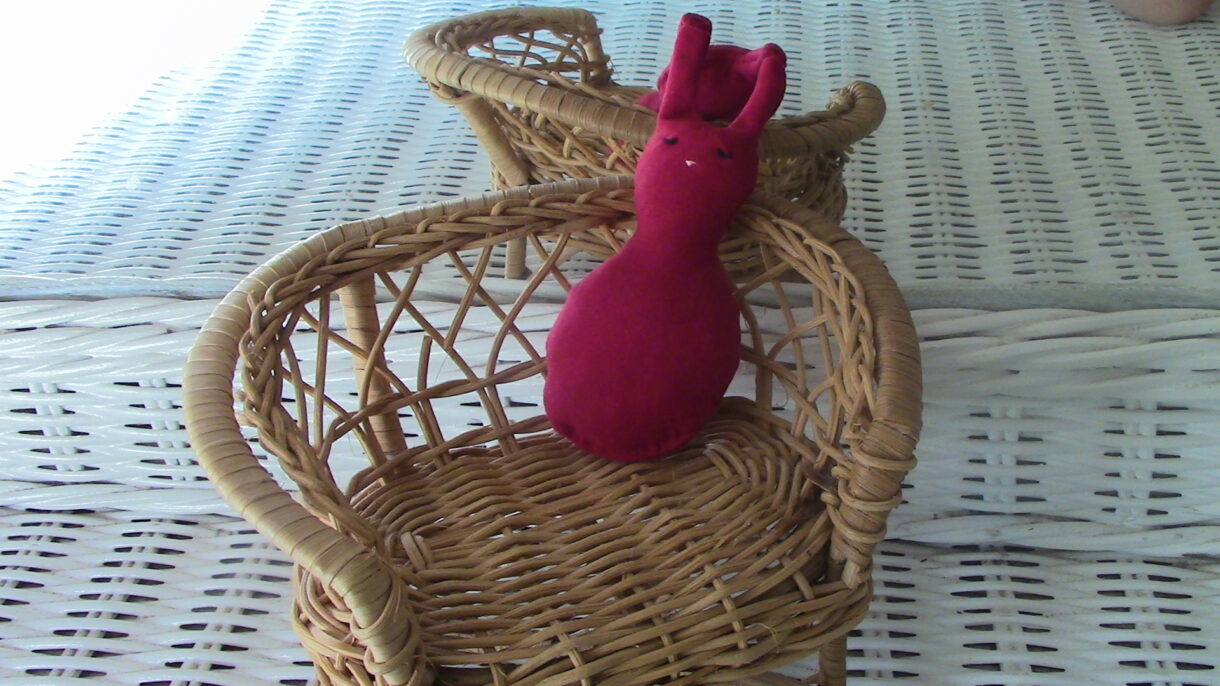 hand sewn pocket sized red stuffed rabbit