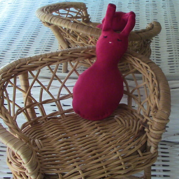 hand sewn pocket sized red stuffed rabbit
